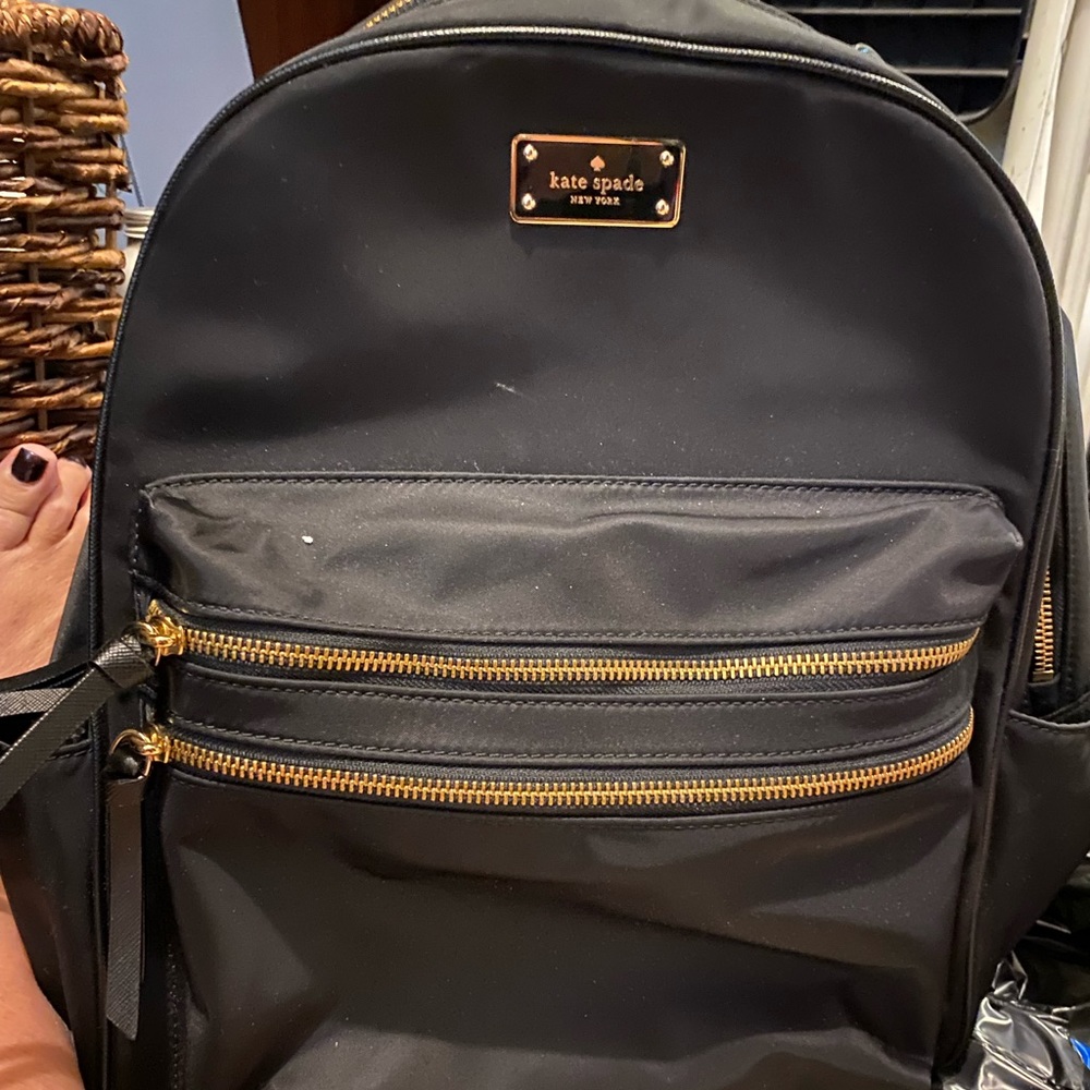 Kate Spade back pack. Only used twice to go over seas.